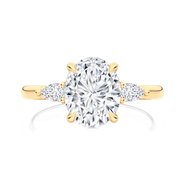 Oval Diamond Three Stone Ring in Yellow Gold | Cala