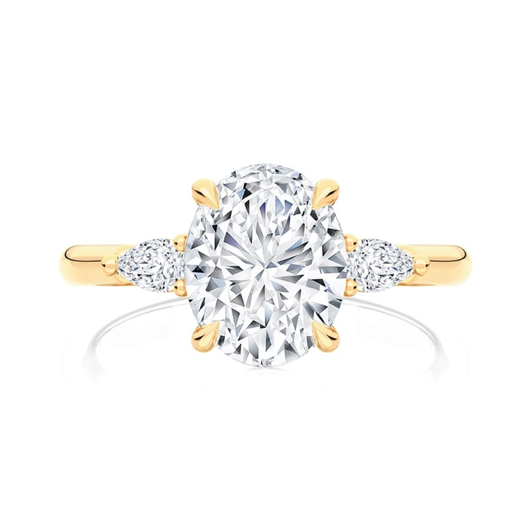 Oval Diamond Three Stone Ring in Yellow Gold | Cala