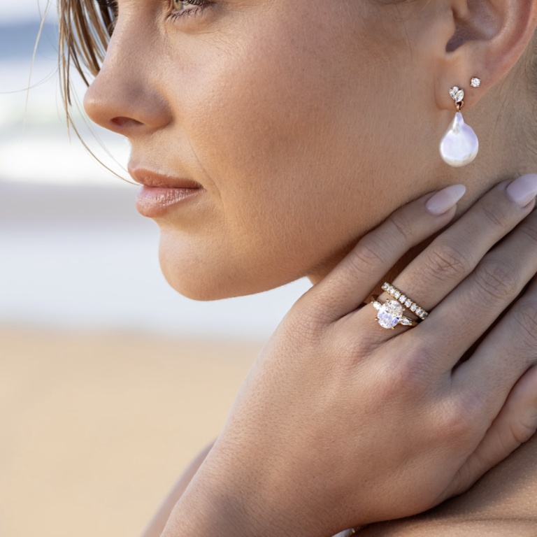 brisbane photoshoot of yellow gold engagement ring with a oval cut diamond in the centre